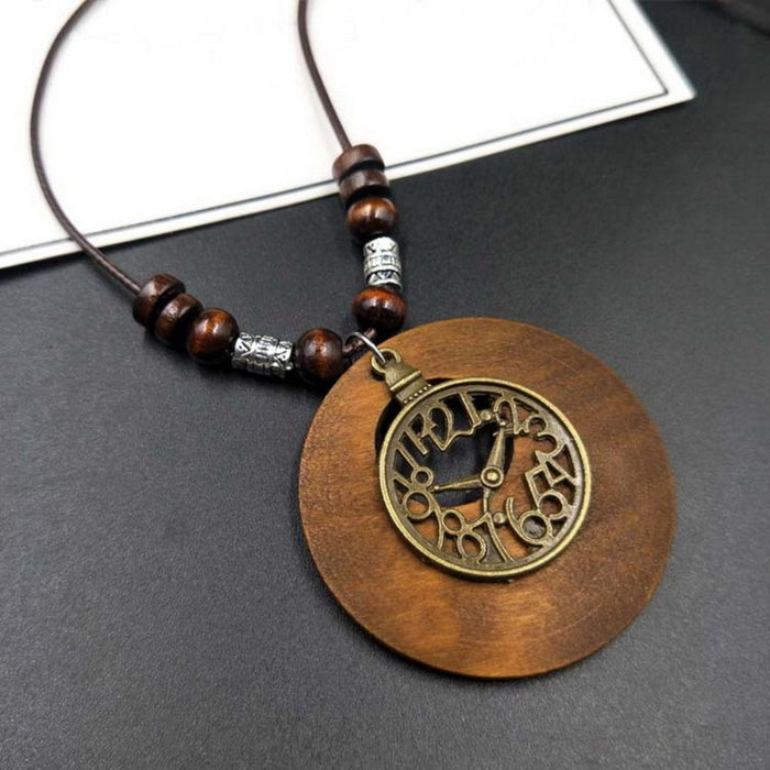 Artistieke Houten Ronde Ketting - prachtige bronzen metalen accenten - unieke materialenmix - huishoudmeester